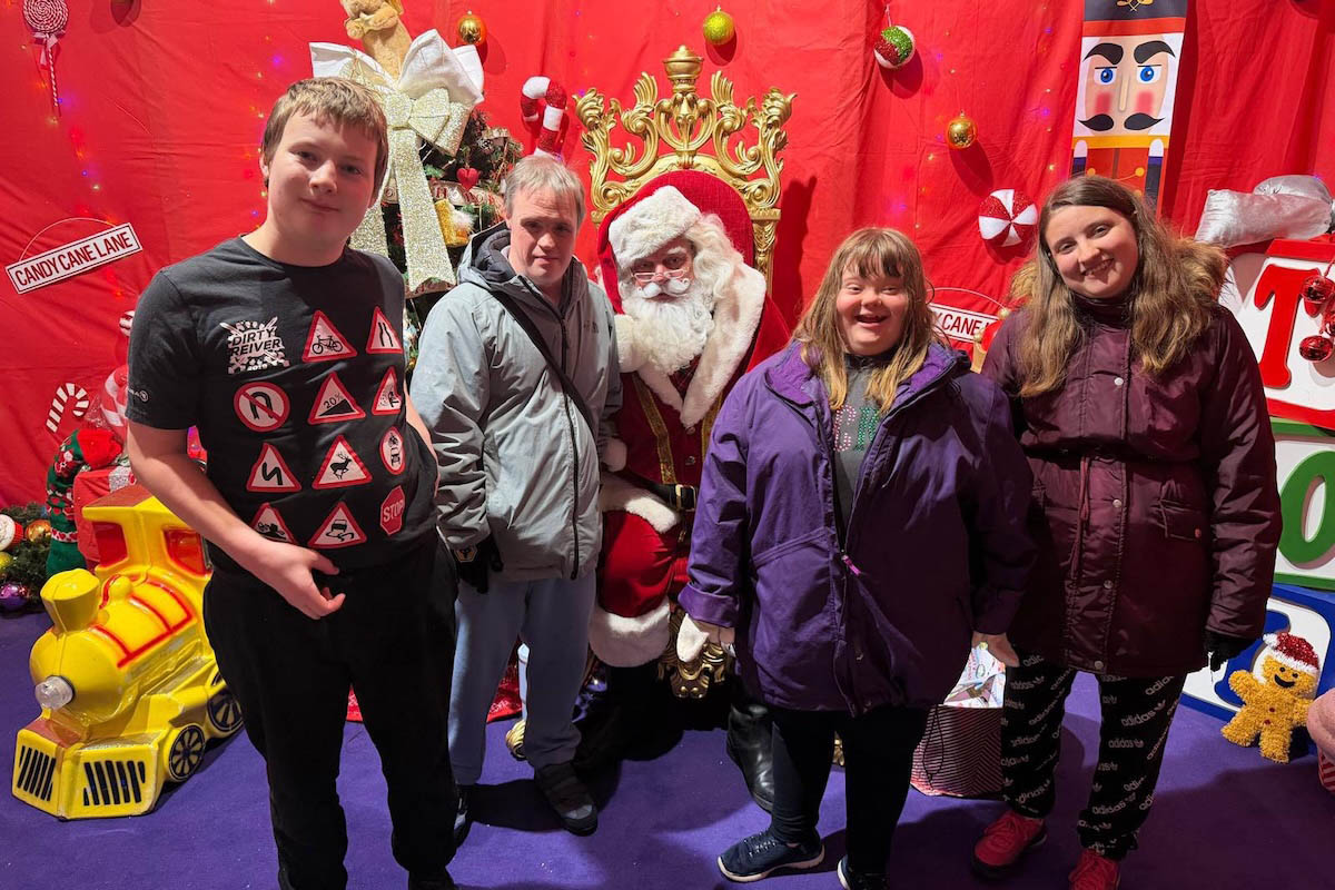 Group of service users meeting Santa Claus during a festive activity