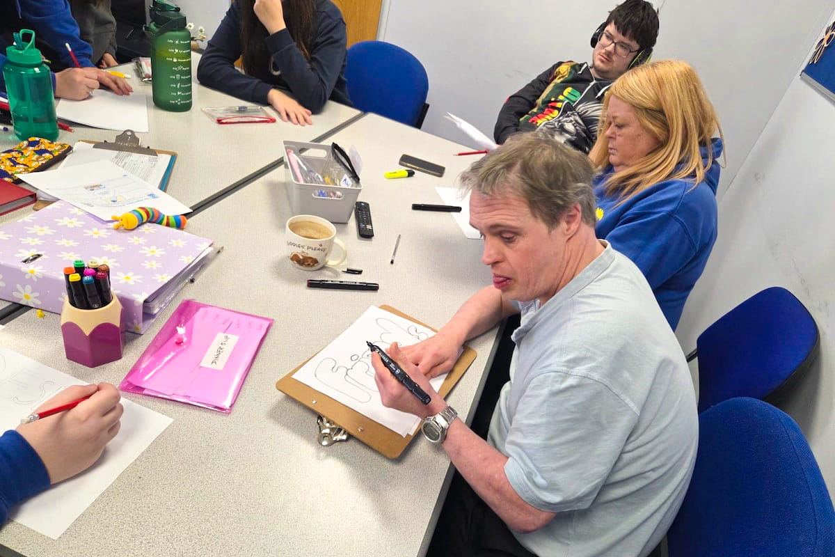 Group taking part in a life skills session with Taylor Support staff
